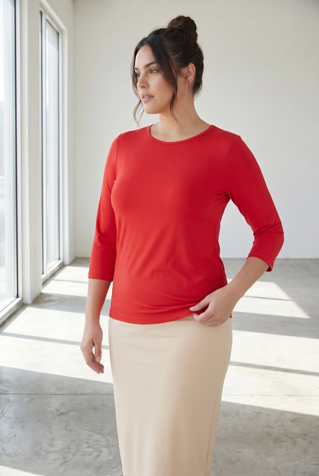 Model wearing Nuggles® 3/4 Essential Tee in Red