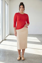Model wearing Nuggles® 3/4 Essential Tee in Red