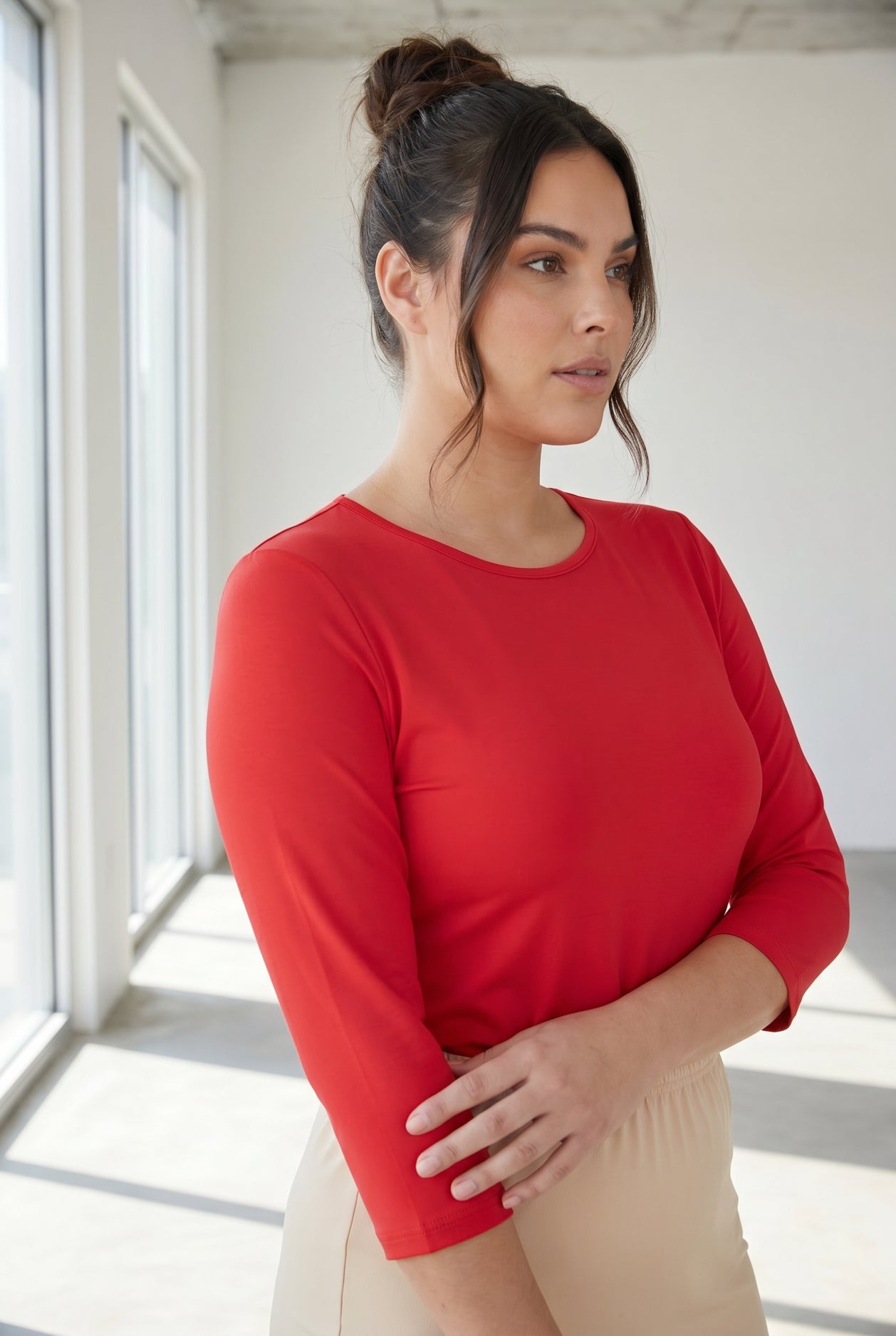 Model wearing Nuggles® 3/4 Essential Tee in Red