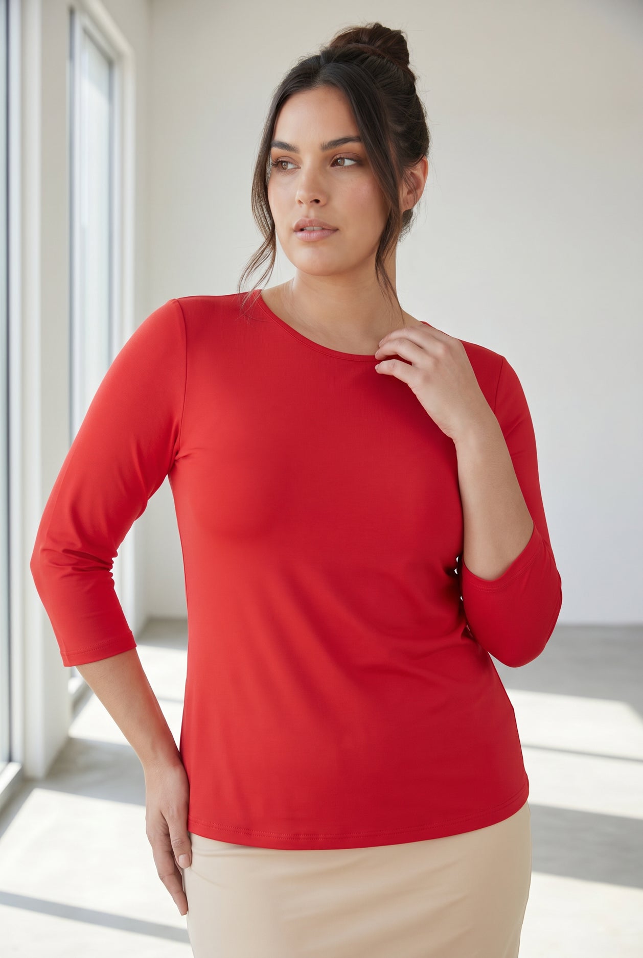 Model wearing Nuggles® 3/4 Essential Tee in Red