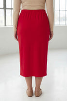 Model wearing Nuggles® 31" Classic Skirt in Red