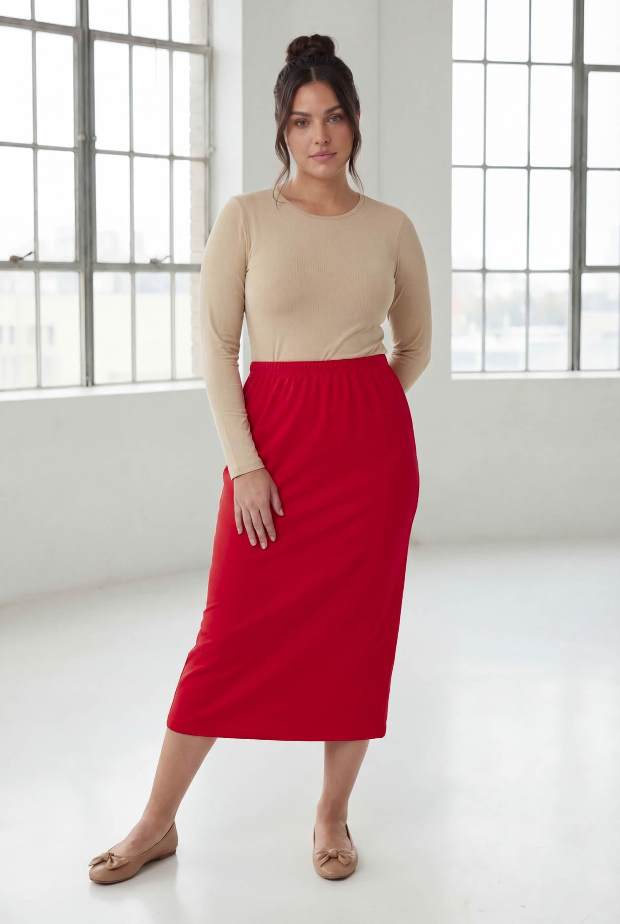 Model wearing Nuggles® 31" Classic Skirt in Red