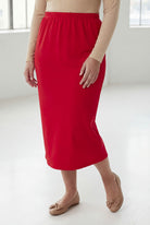 Model wearing Nuggles® 31" Classic Skirt in Red