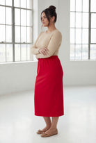 Model wearing Nuggles® 31" Classic Skirt in Red