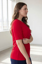 Model wearing the Nuggles® Essential Half Sleeve Tee in Red 