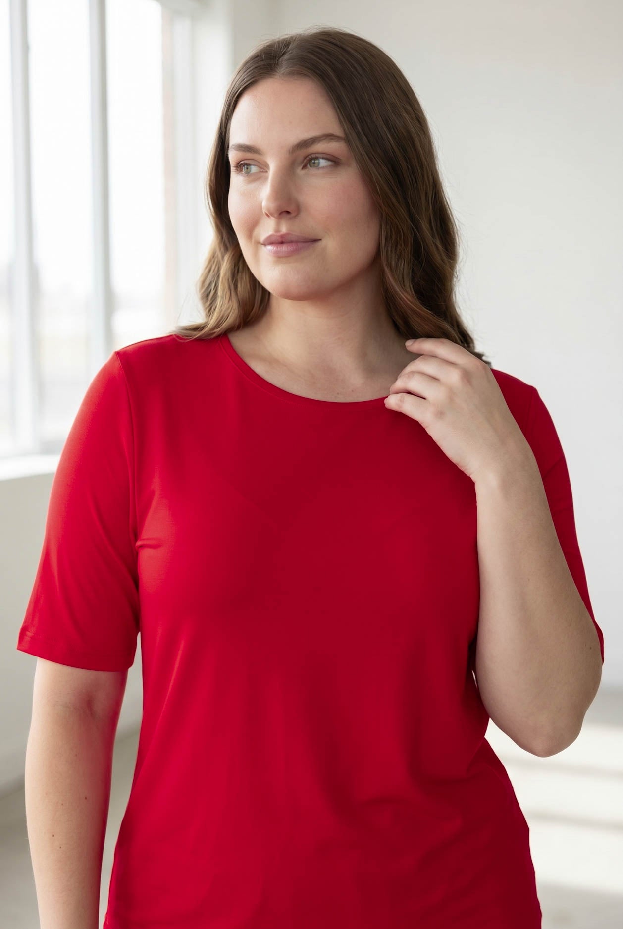 Model wearing the Nuggles® Essential Half Sleeve Tee in Red 