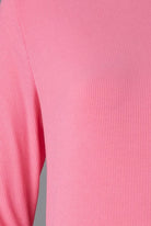 Model wearing Nuggles® Ribbed Midi Layering Dress in Pink