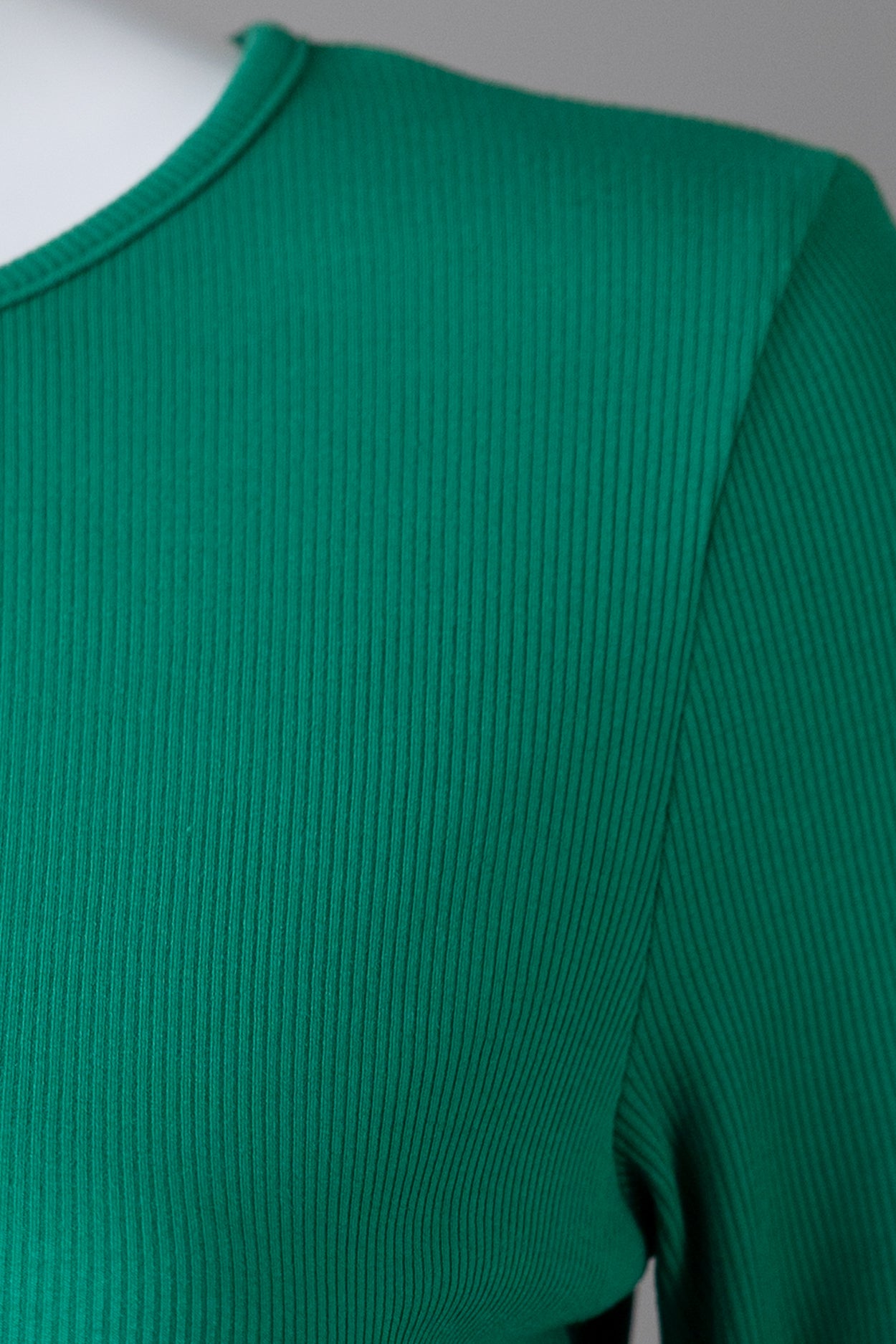 Model wearing Nuggles® 3/4 Essential Ribbed Tee in Kelly Green