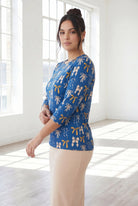 Model wearing Nuggles® 3/4 Essential Tee in Ribbon Day