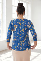 Model wearing Nuggles® 3/4 Essential Tee in Ribbon Day