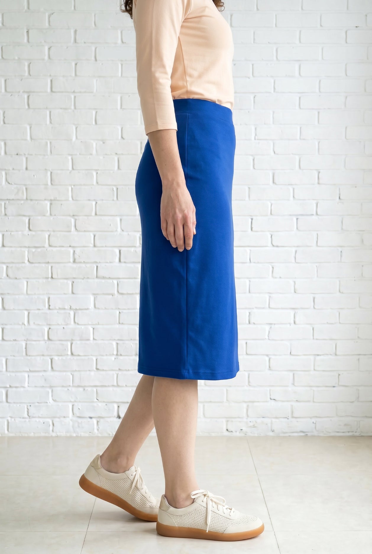 Model wearing Nuggles® 27" Relaxed Skirt in Royal Blue