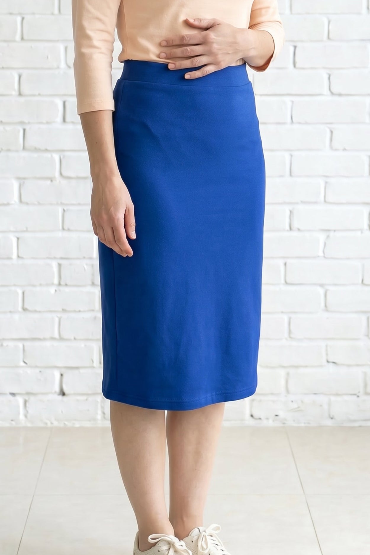 Model wearing Nuggles® 27" Relaxed Skirt in Royal Blue