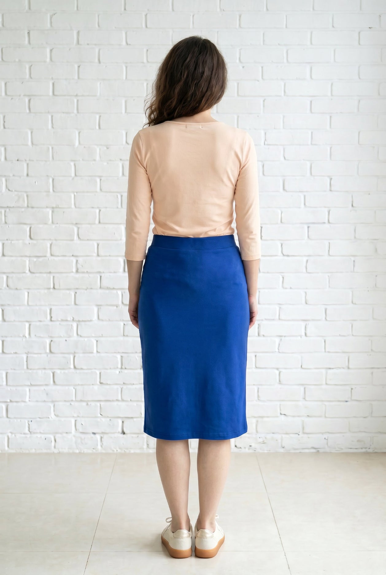 Model wearing Nuggles® 27" Relaxed Skirt in Royal Blue