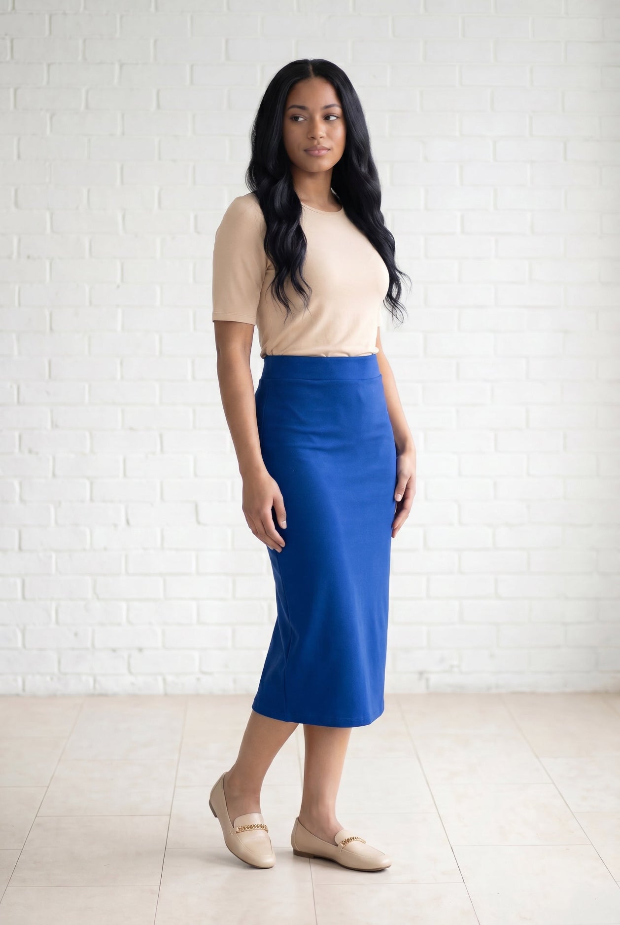 Model wearing Nuggles® 31" Relaxed Skirt in Royal Blue