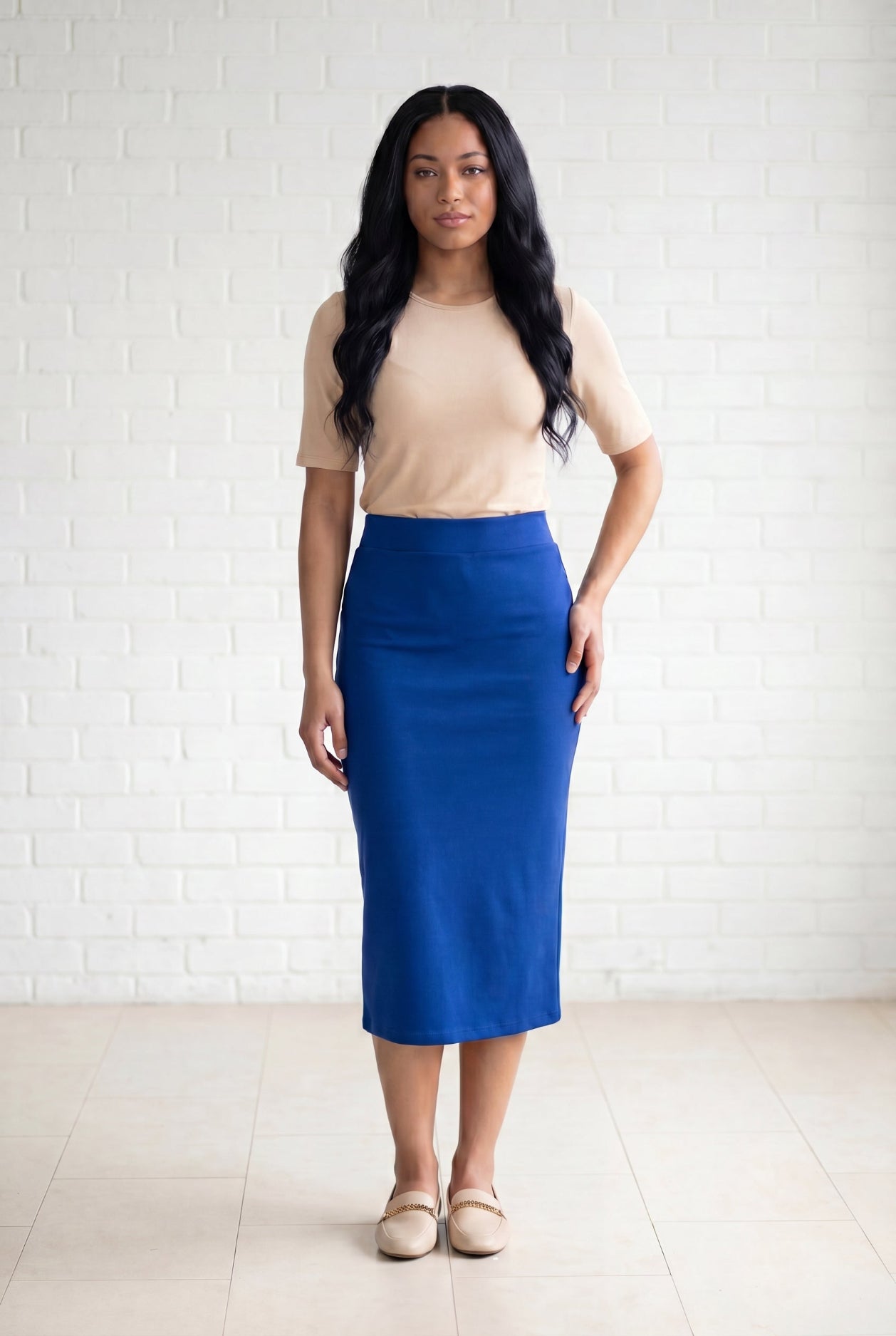 Model wearing Nuggles® 31" Relaxed Skirt in Royal Blue