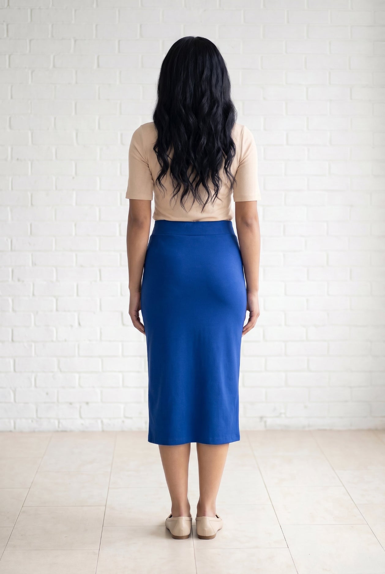 Model wearing Nuggles® 31" Relaxed Skirt in Royal Blue