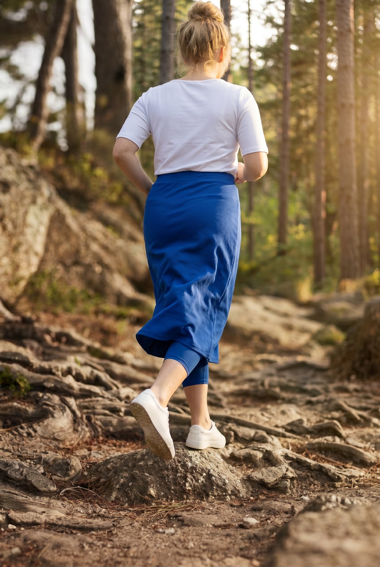 Model wearing Nuggles® 31" All-Sport Skirt in Royal Blue