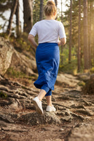 Model wearing Nuggles® 31" All-Sport Skirt in Royal Blue