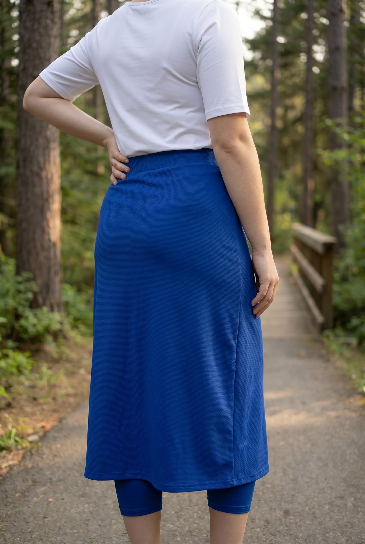 Model wearing Nuggles® 31" All-Sport Skirt in Royal Blue