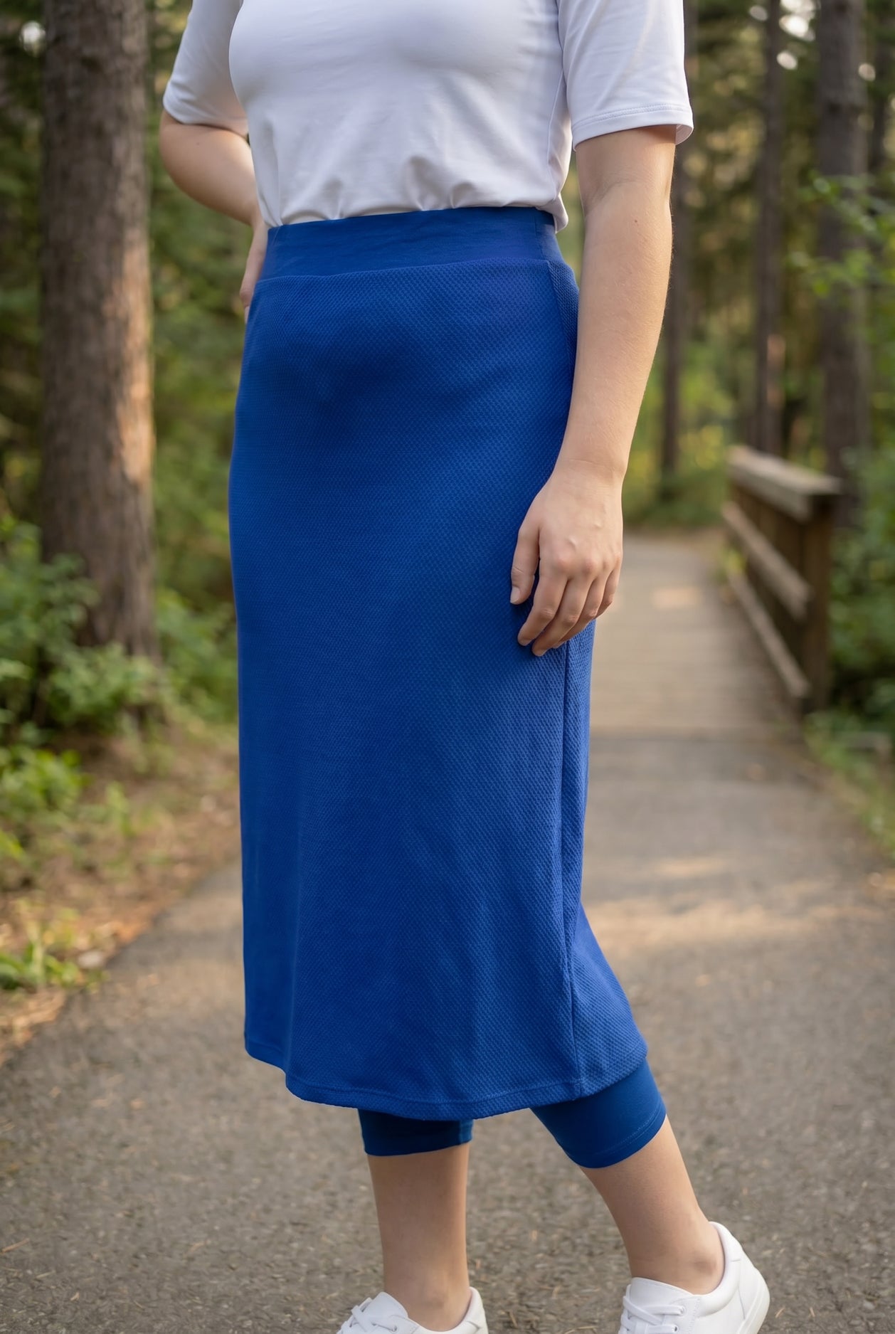 Model wearing Nuggles® 31" All-Sport Skirt in Royal Blue