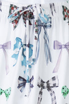 White fabric with colorful bow patterns