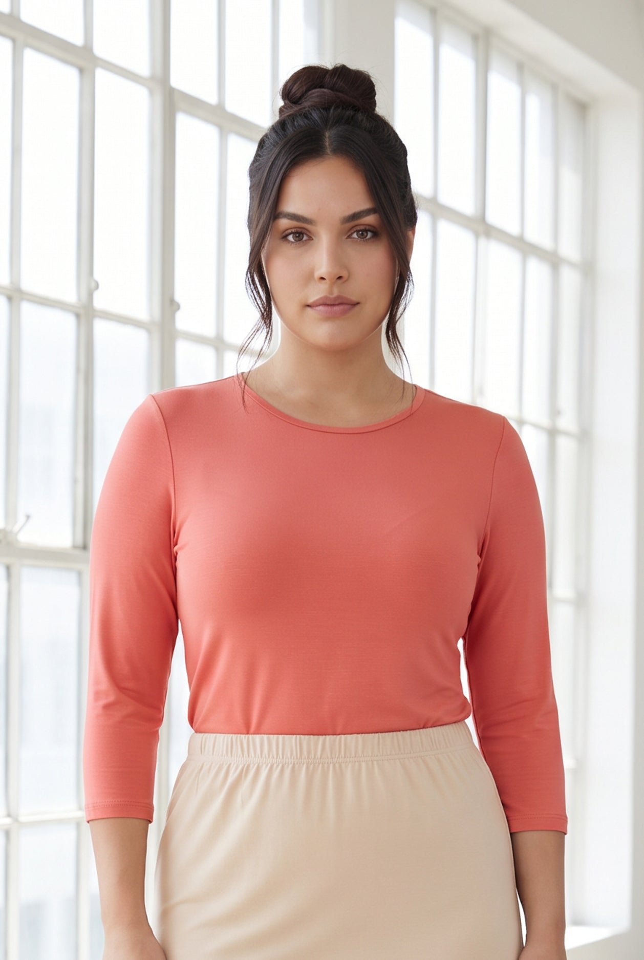 Model wearing Nuggles® 3/4 Essential Tee in Salmon