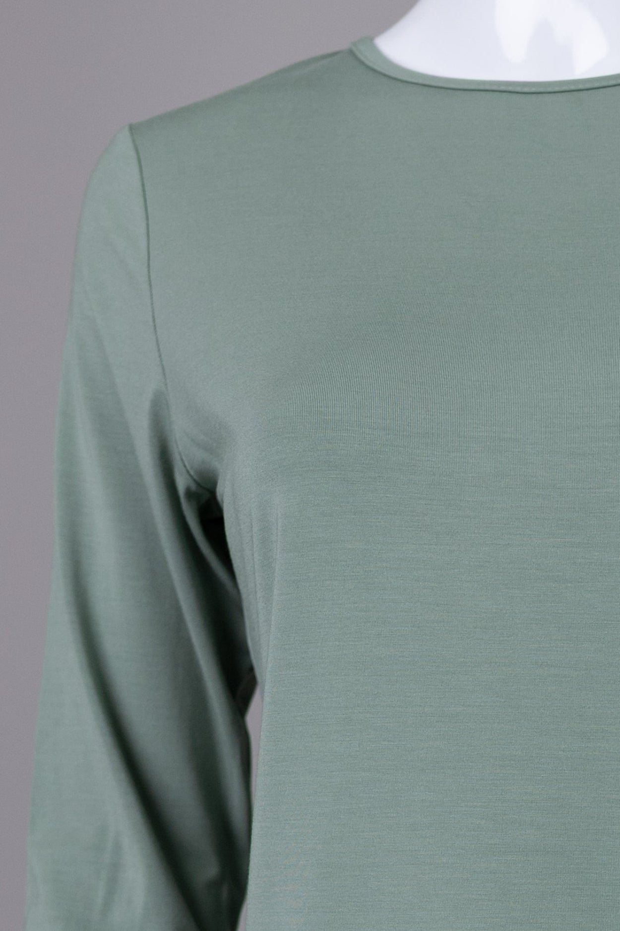Model wearing Nuggles® 3/4 Essential Tee in Seafoam Green