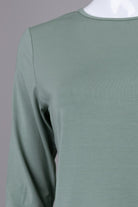 Model wearing Nuggles® 3/4 Essential Tee in Seafoam Green