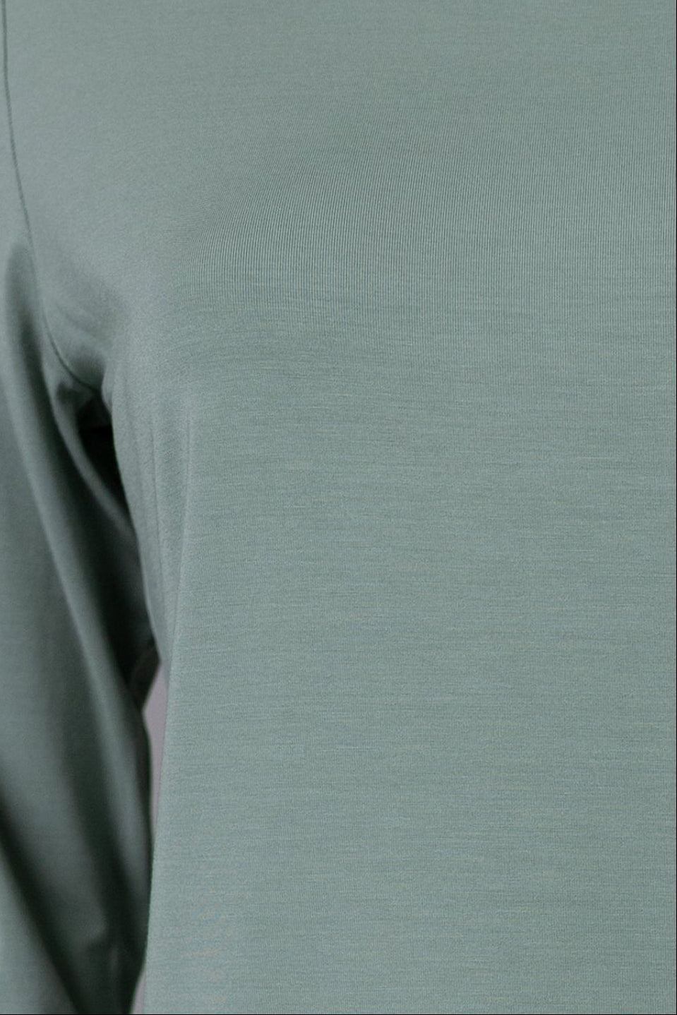 Model wearing Nuggles® 3/4 Essential Tee in Seafoam Green