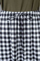 Model wearing Nuggles®  Sage Skirt in Sweet Gingham