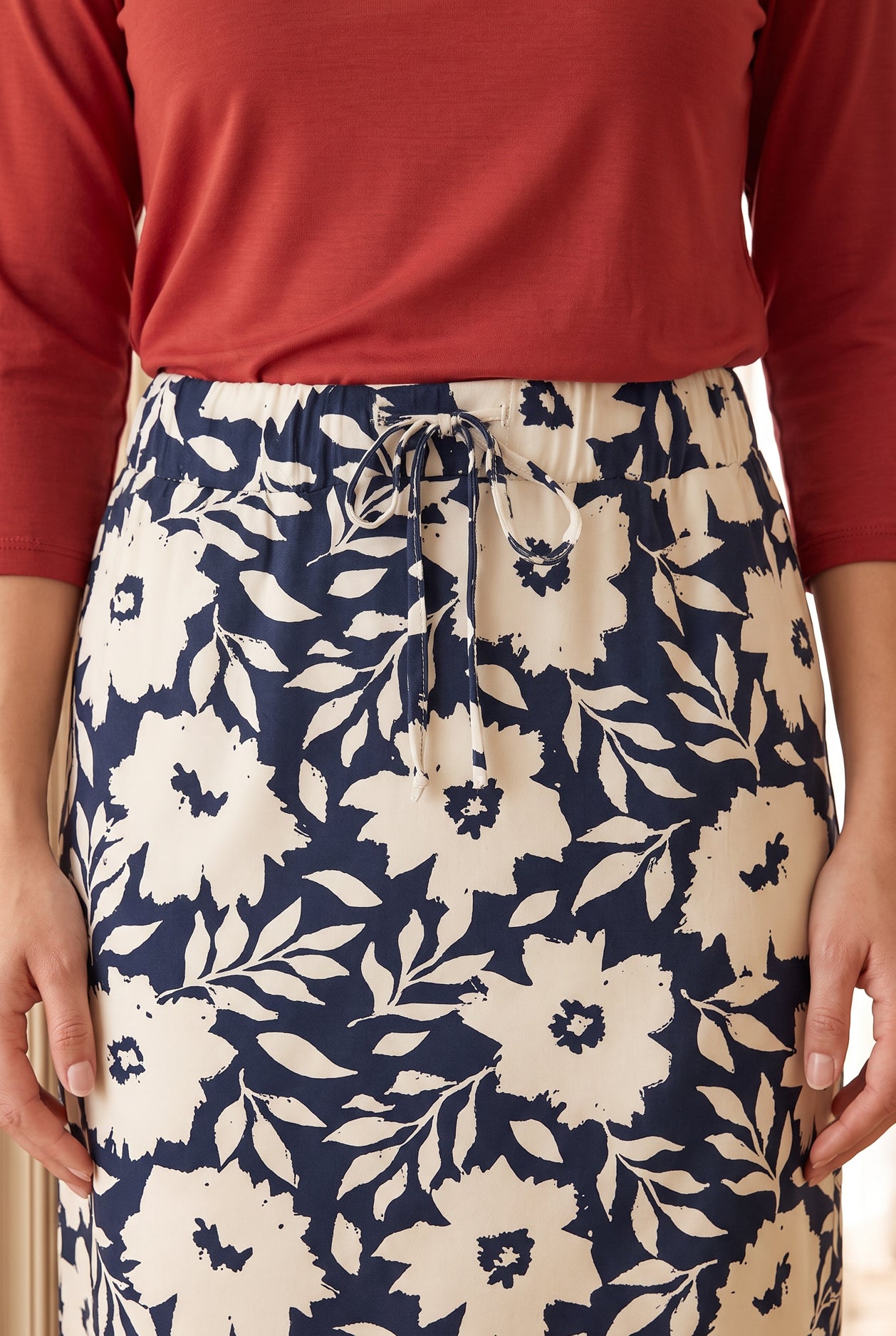 Model wearing Nuggles®  27" Drawstring Skirt in Shadow Petal