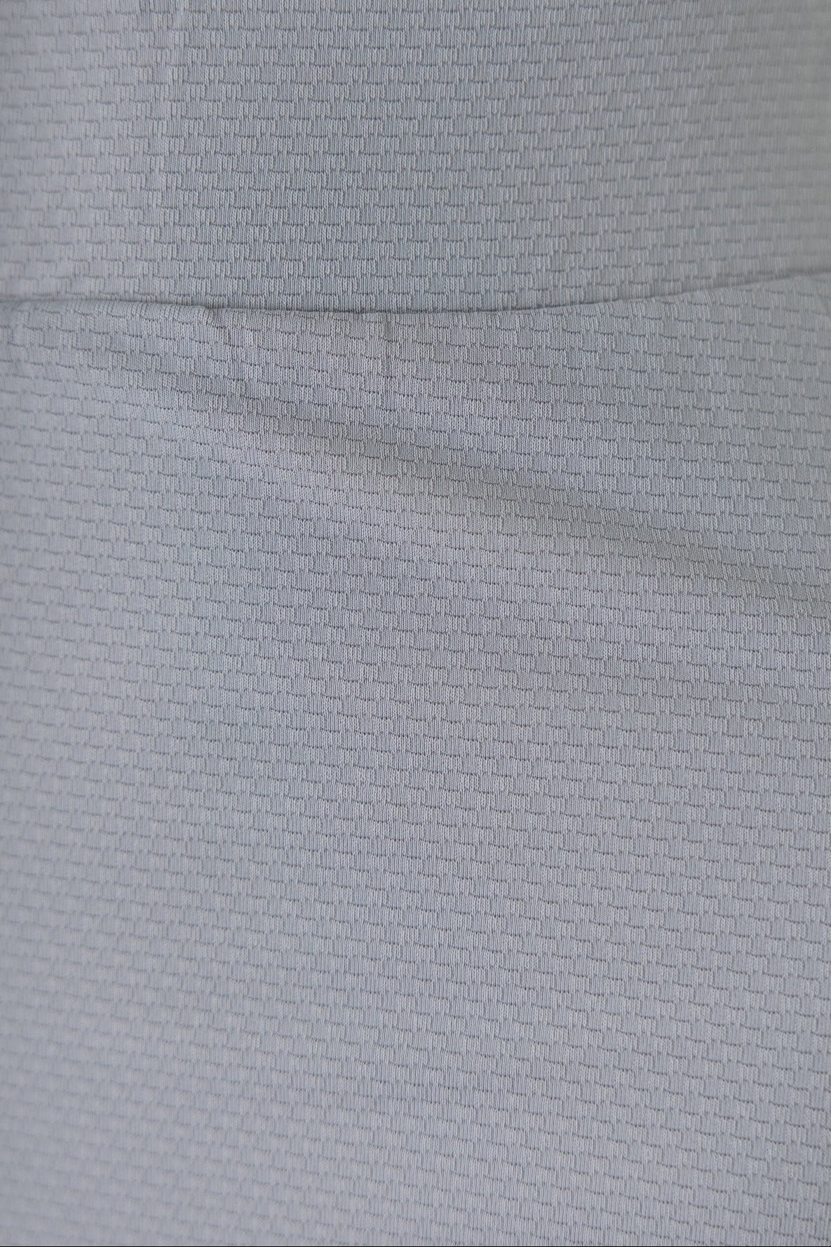 Close Up Detail Shot of Silver Sport Fabric