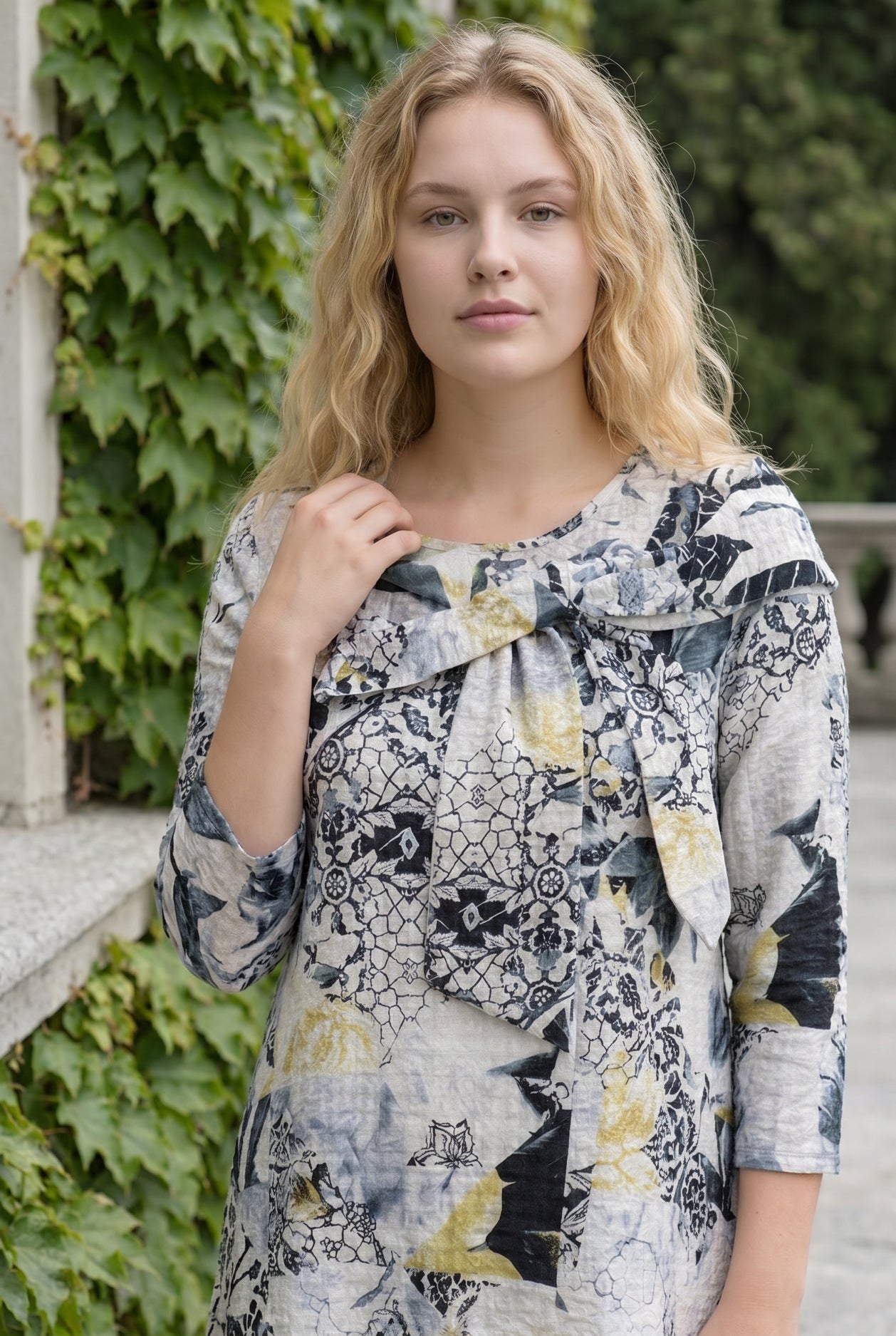Nuggles Eleanor Top in Sketchbook, hand-drawn print on white modest top with signature bow neckline
