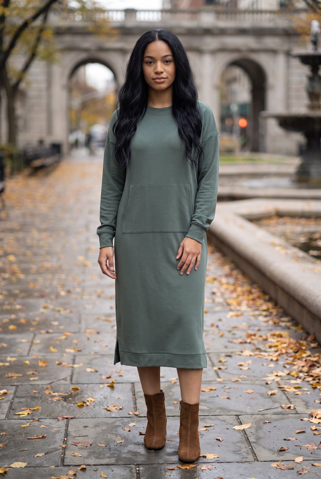 Nuggles® Oakley Hoodie Dress in Steel Blue, full-length front view on a wet stone walkway with brown ankle boots