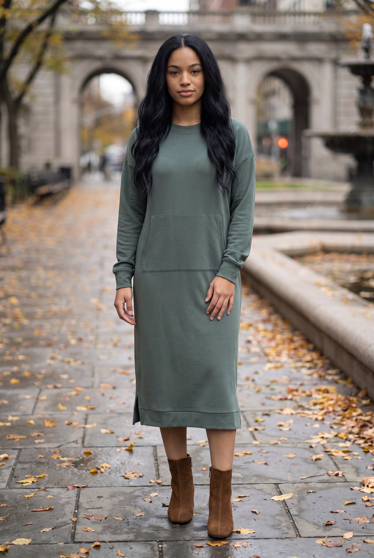 Nuggles® Oakley Hoodie Dress in Steel Blue, full-length front view on a wet stone walkway with brown ankle boots