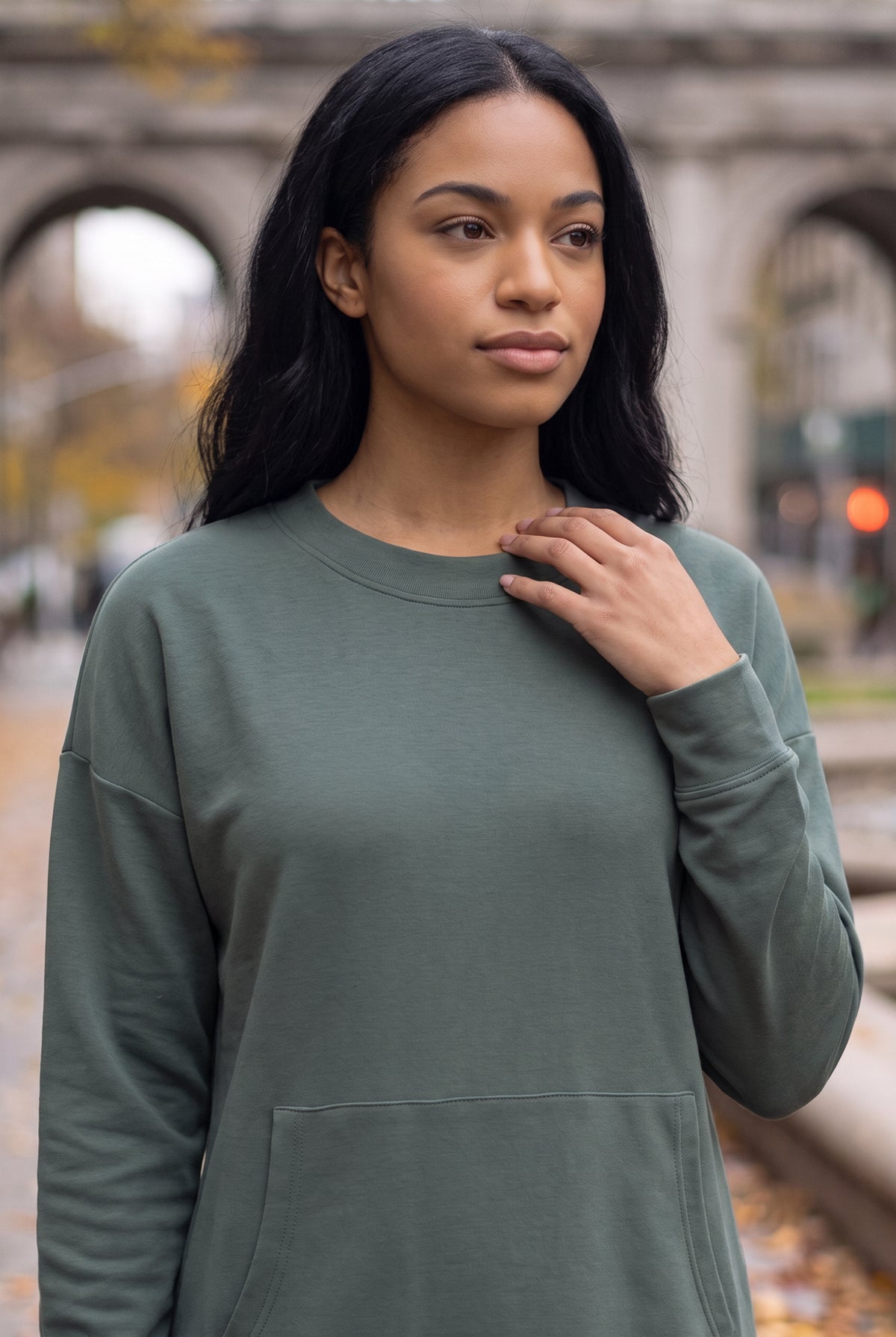 Nuggles® Oakley Hoodie Dress in Steel Blue, waist-up view with a hand at the ribbed crew neckline