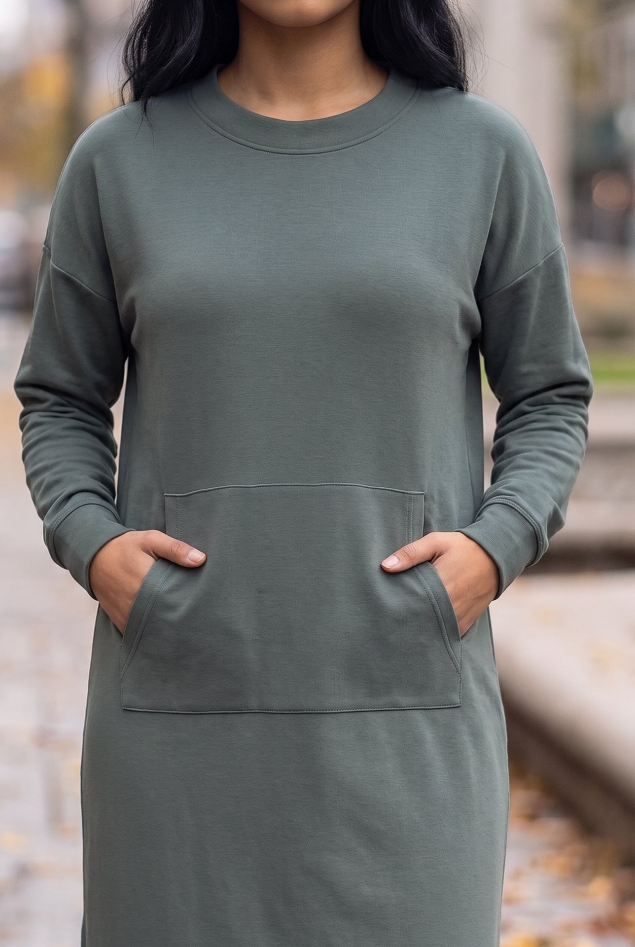 Nuggles® Oakley Hoodie Dress in Steel Blue, close-up with both hands tucked in the front pocket