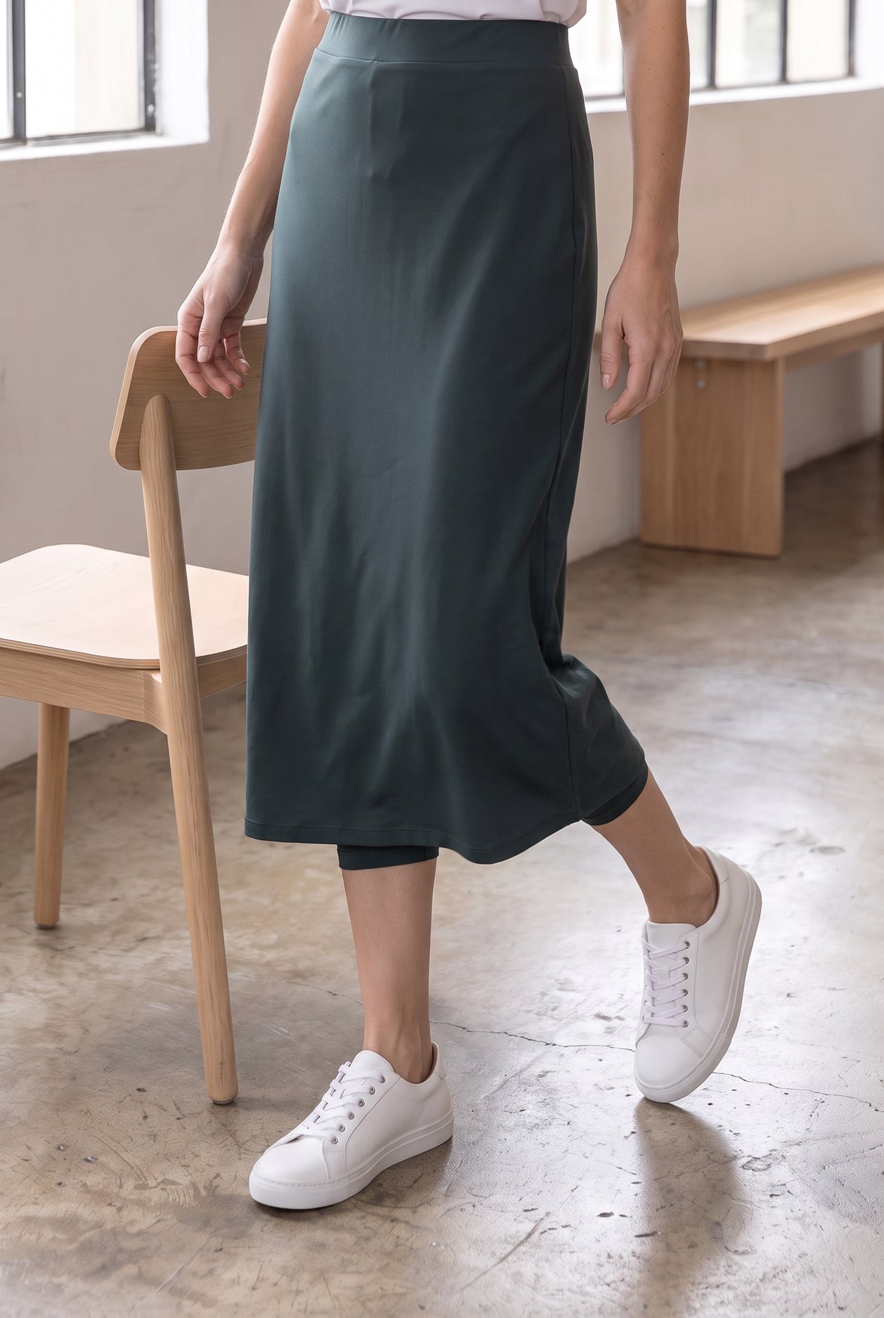 Model wearing Nuggles®  31" Sport Skirt in Smokey Green