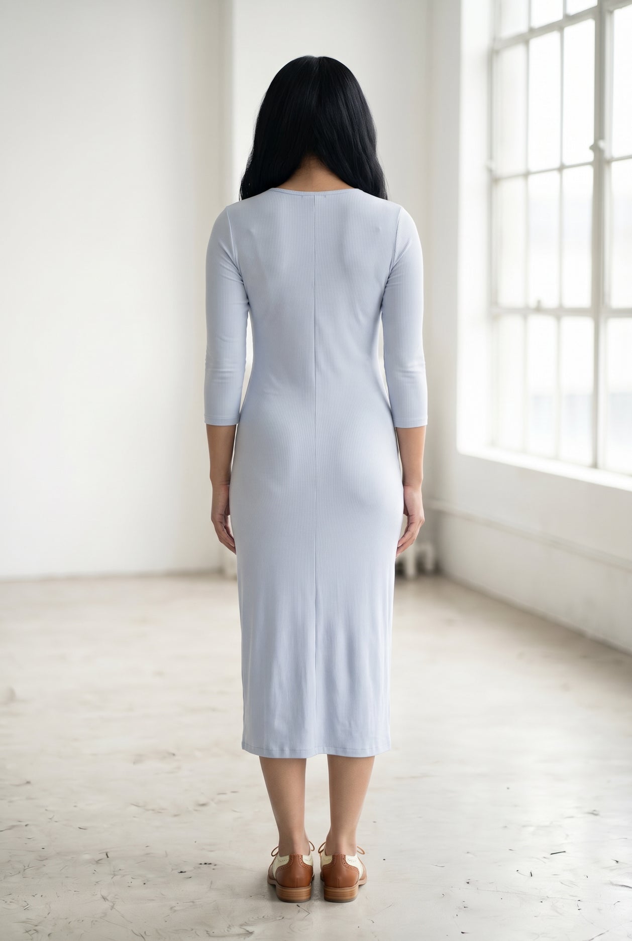 Model wearing Nuggles® Ribbed Midi Layering Dress in Soft Blue