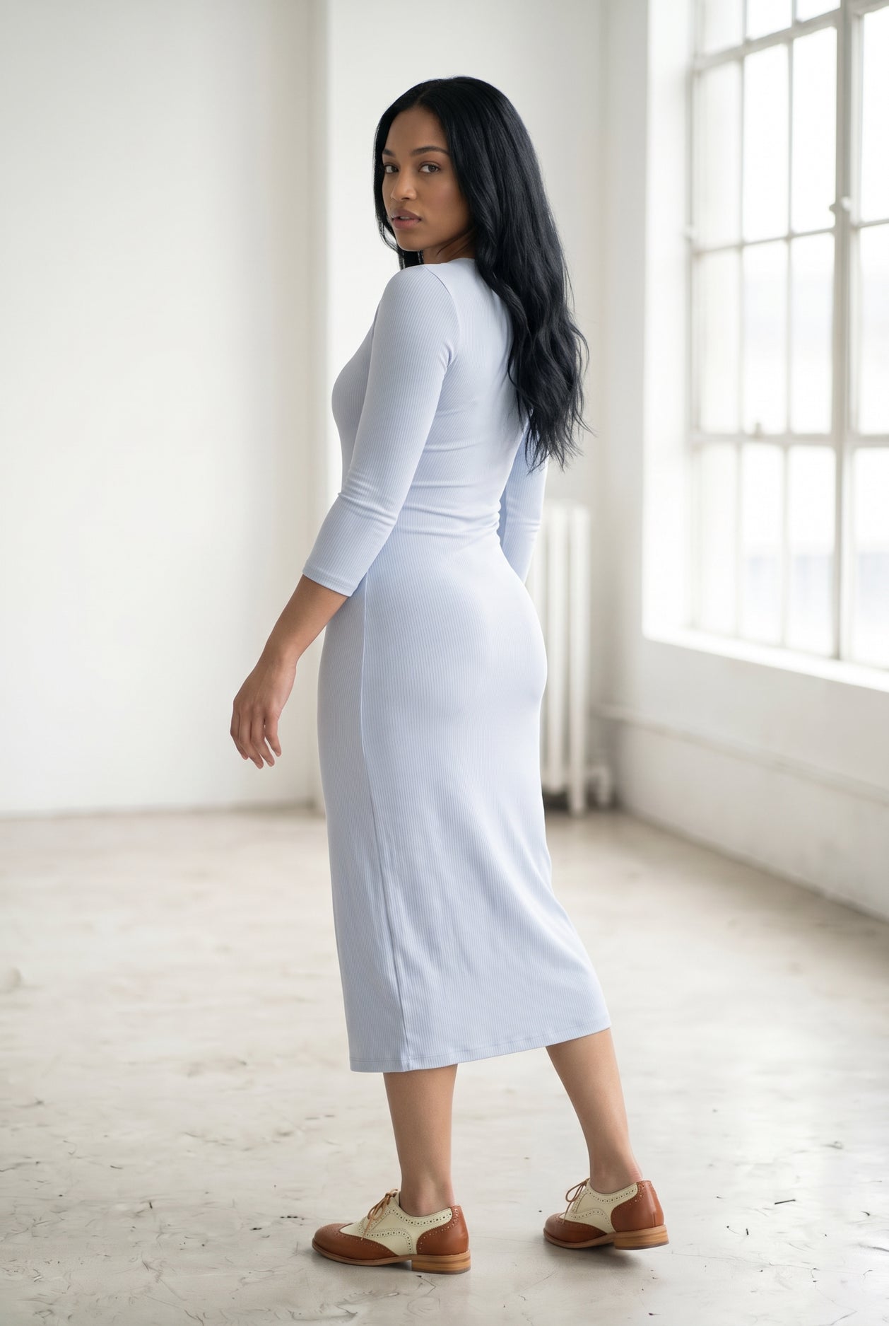 Model wearing Nuggles® Ribbed Midi Layering Dress in Soft Blue