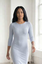 Model wearing Nuggles® Ribbed Midi Layering Dress in Soft Blue