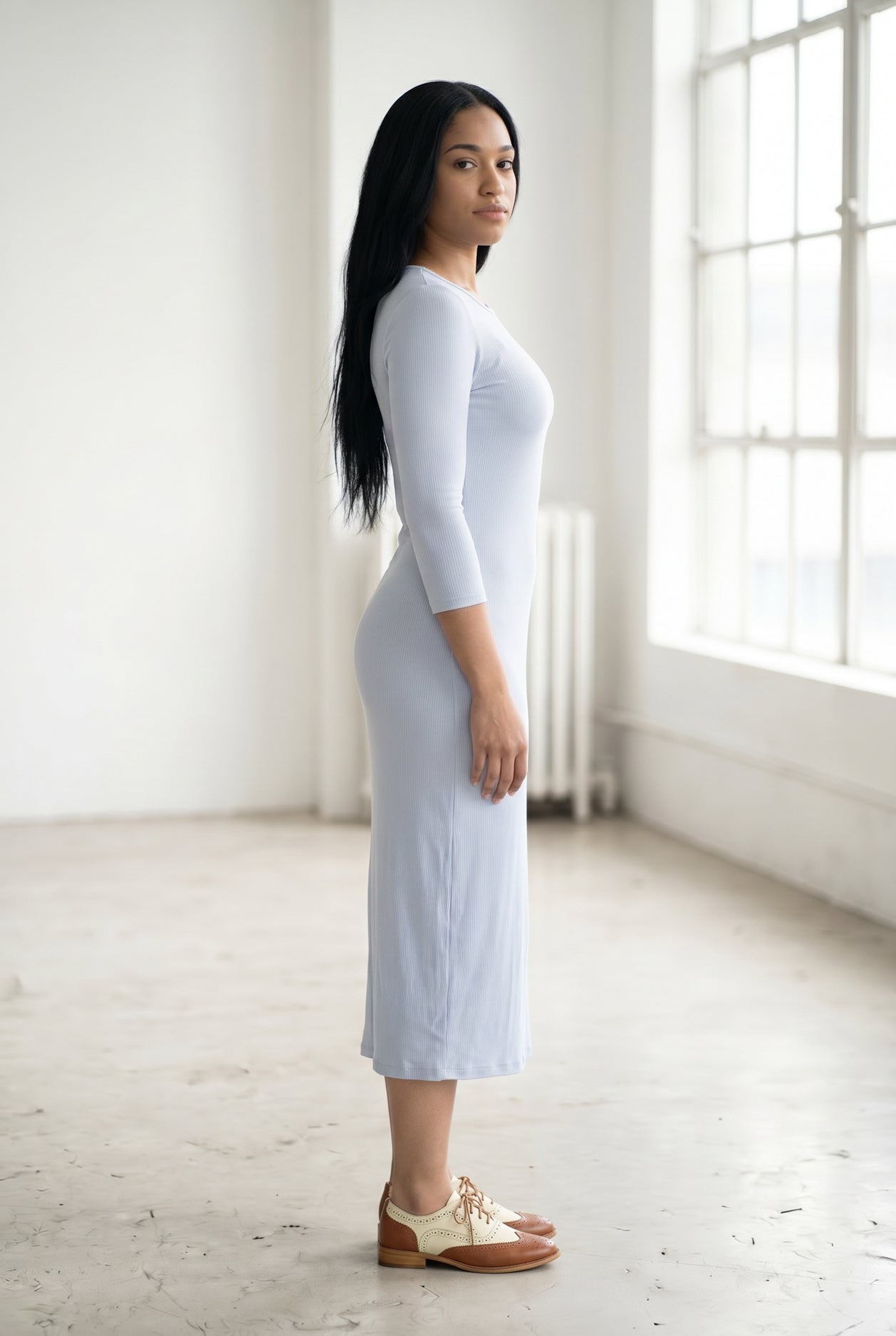 Model wearing Nuggles® Ribbed Midi Layering Dress in Soft Blue
