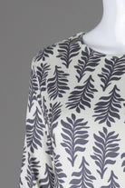 Model wearing Nuggles® Midi Layering Dress in Soft Fern