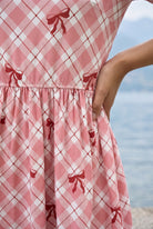Sugar Bow Nova Midi Dress by Nuggles, modest 3/4-sleeve dress in sweet pink bow-dotted print