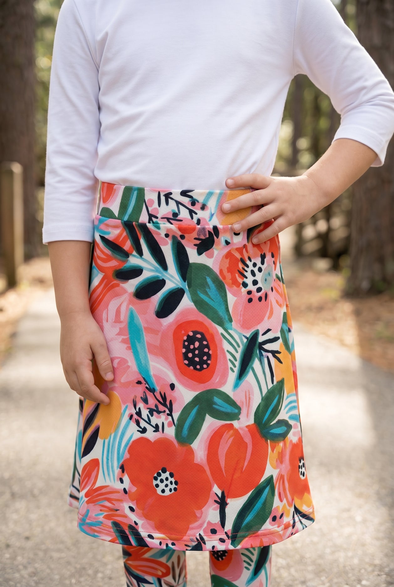 Model wearing Nuggles® Girls All-Sport Skirt in Summer Tropic