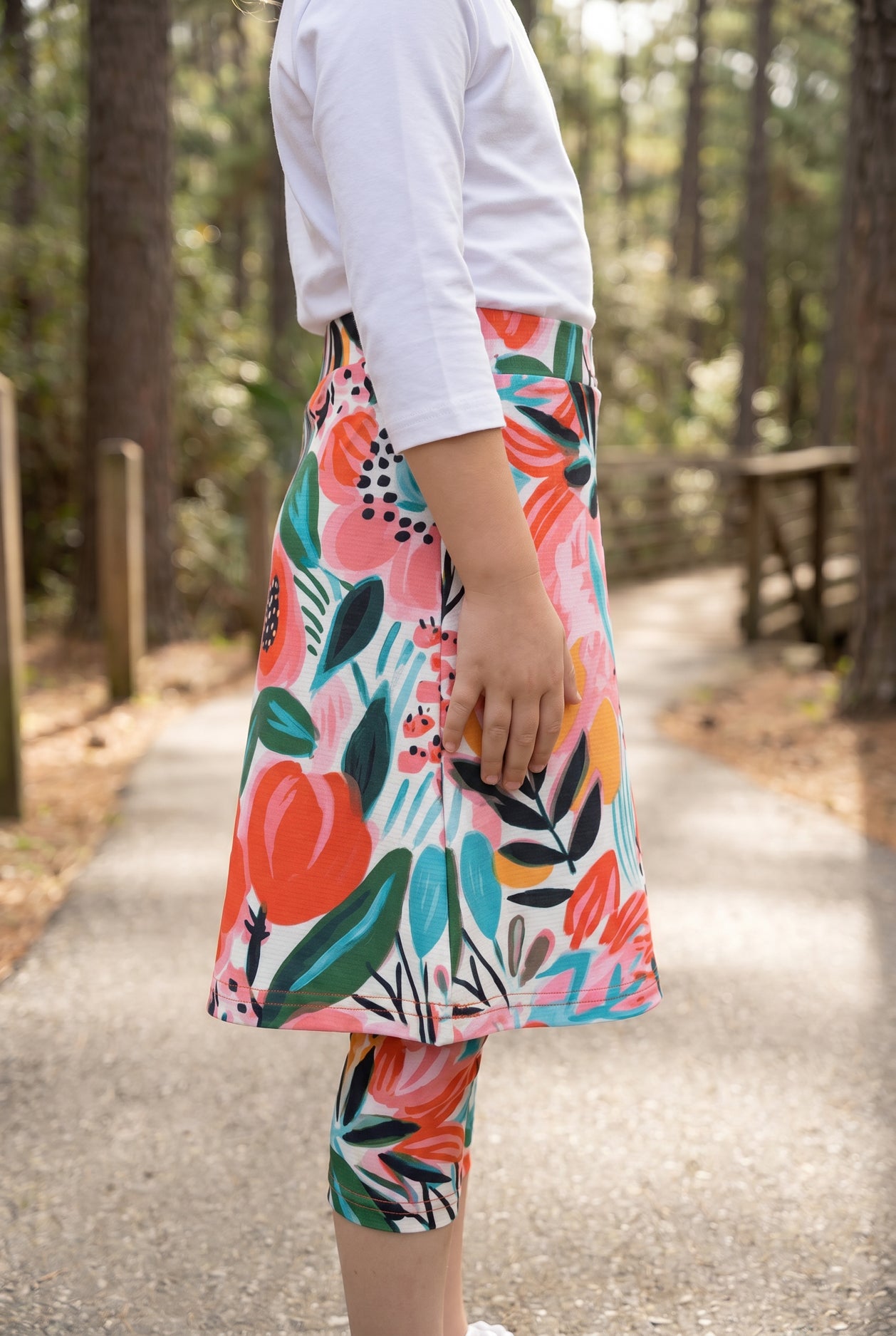 Model wearing Nuggles® Girls All-Sport Skirt in Summer Tropic