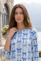 Model wearing Nuggles® Gracie Dress in Sweet Bows