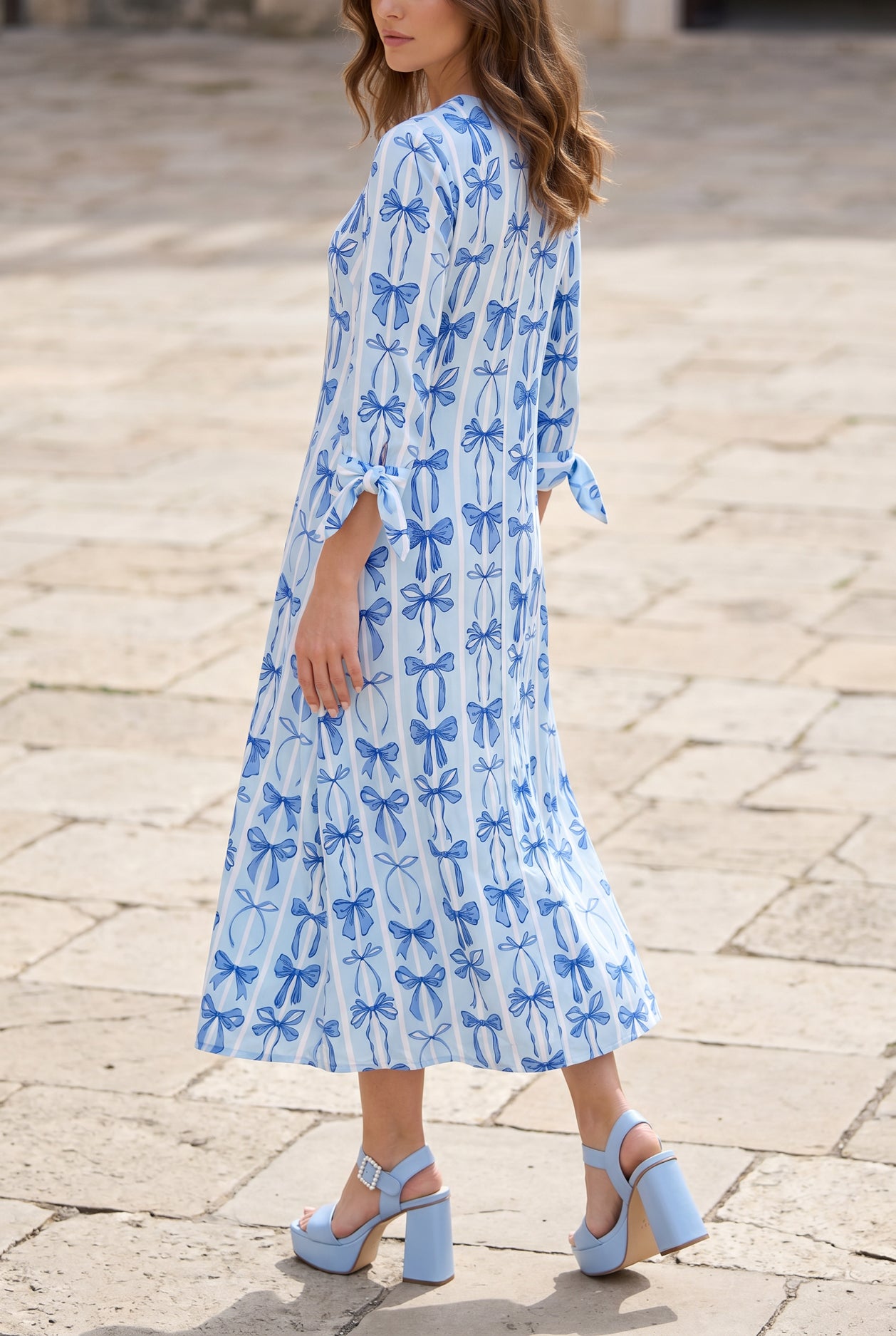 Model wearing Nuggles® Gracie Dress in Sweet Bows