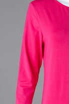 Model wearing Nuggles® Tea Layering Dress in Hot Pink