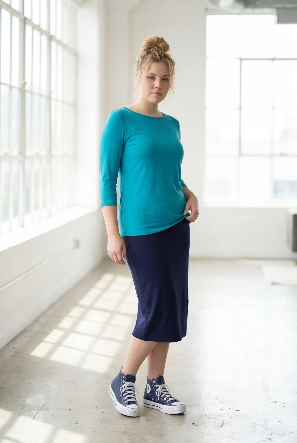 Model wearing the Nuggles® Essential 3/4 Tee in Teal